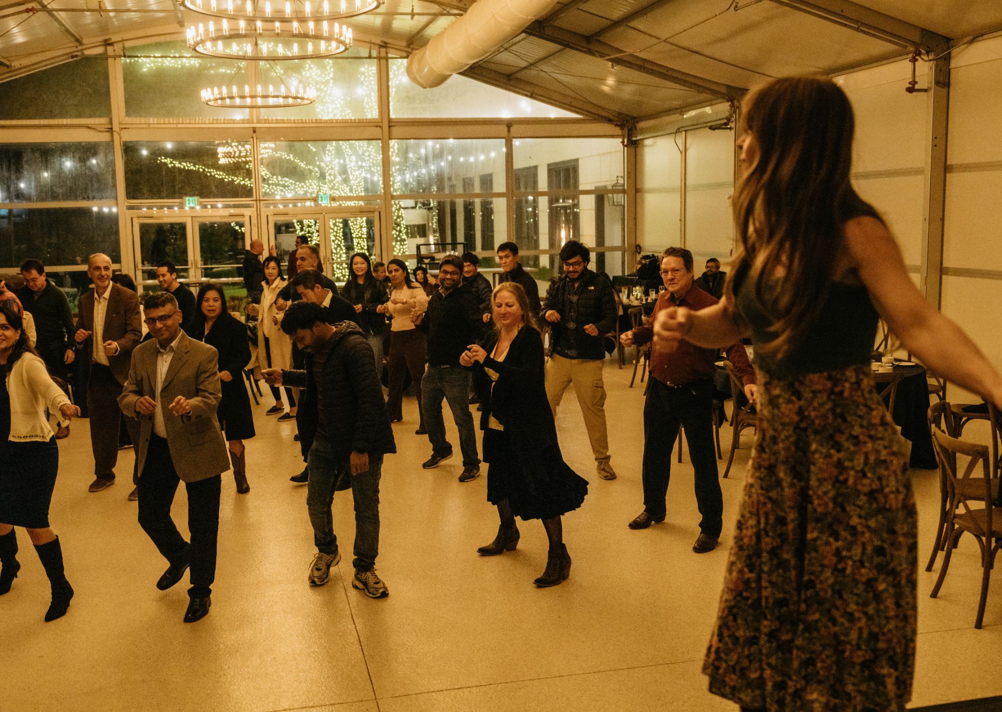 Double or Nothing Two-Step instructor leading a private group lesson at a corporate event