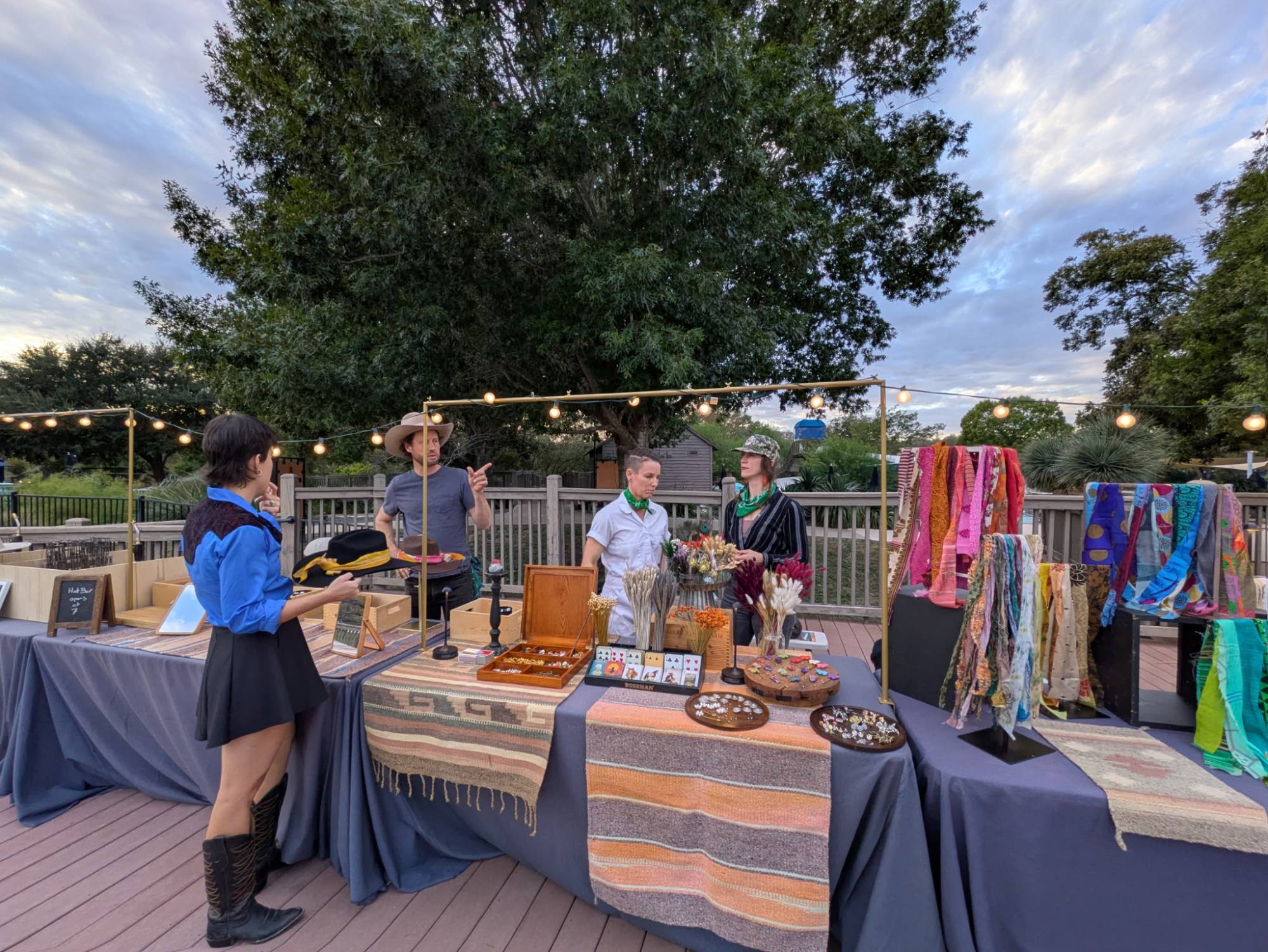 Full Red's Western hat bar setup at outdoor event