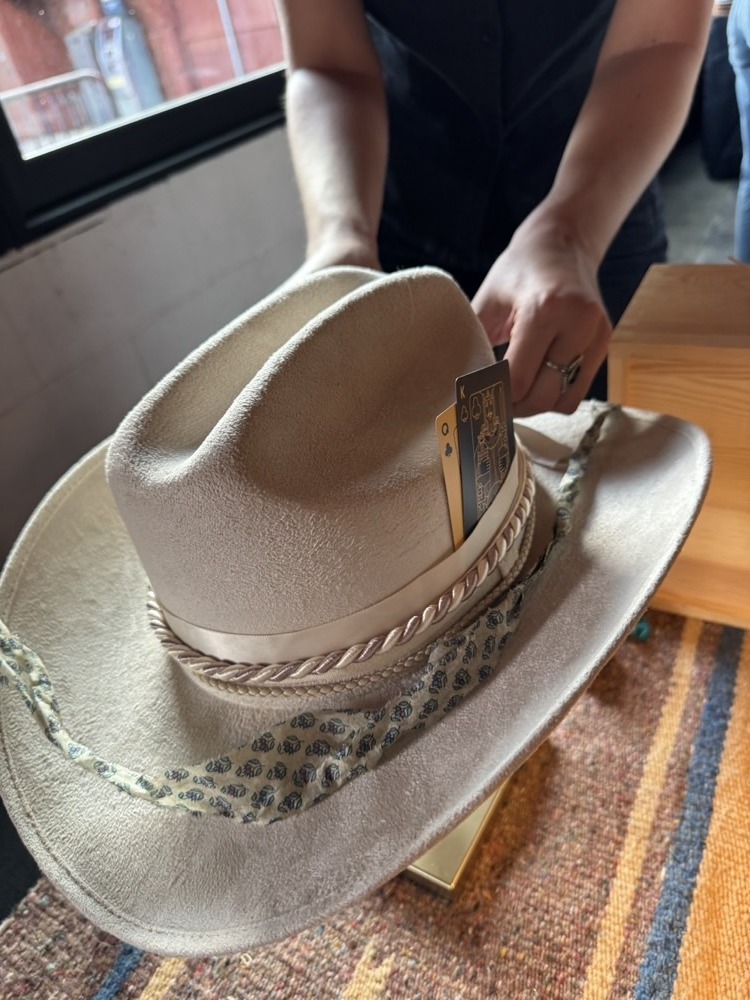 Custom cowboy hats on display at Red's Western hat bar event