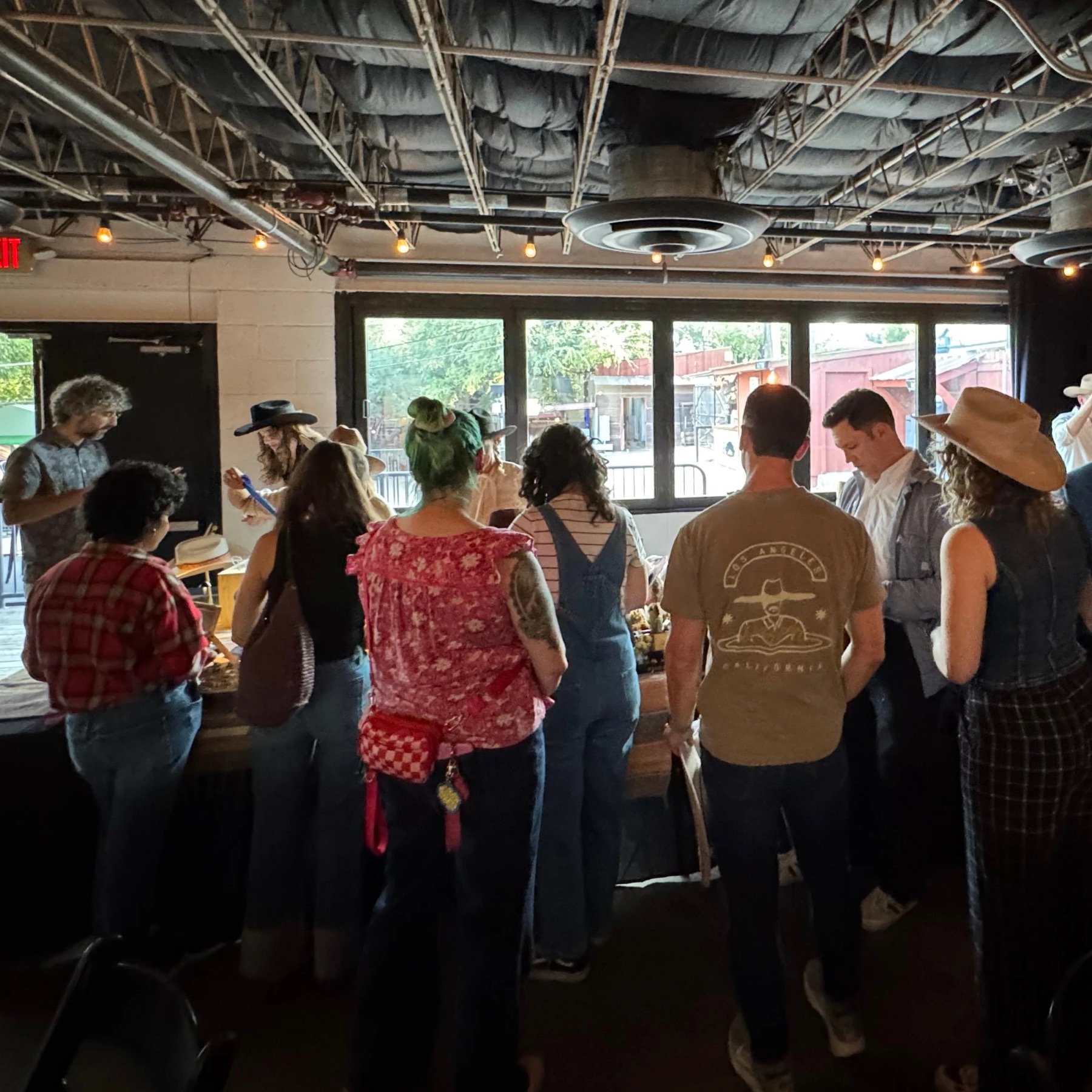 Guests at the Red's Western hat bar